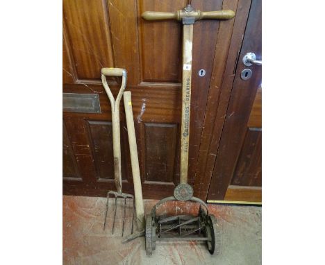 Vintage manual lawnmower 'Ransome's Ace Ballbearing', a small pick and a garden fork
