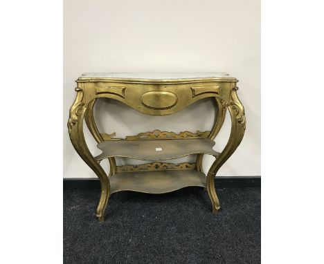 A shaped gilt marble top three tier console table 