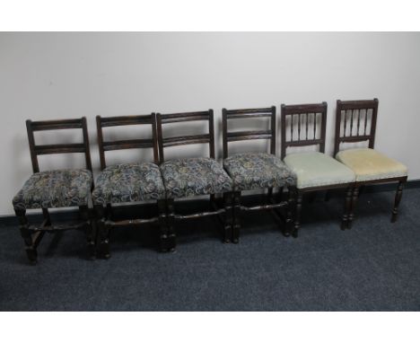 A set of four oak dining chairs upholstered in a tapestry fabric, together with a pair of antique mahogany dining chairs