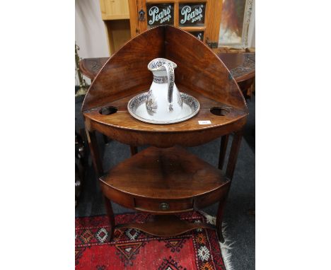 A Georgian mahogany corner washstand together with a china jug and basin