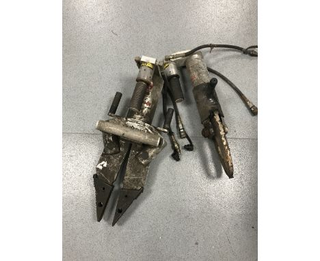 Two Amkus hydraulic cutting tools