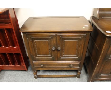 An Ercol double door cabinet fitted with a drawer, width 79cm 