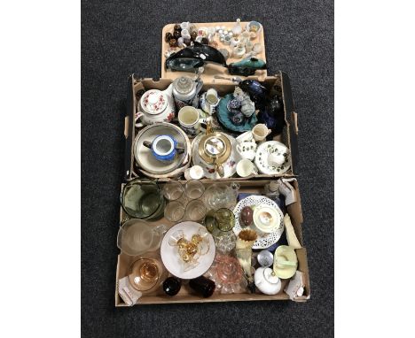 Two boxes and a tray containing assorted china and glassware, including Poole dolphins, thimbles, tea pots, beer steins, etc 