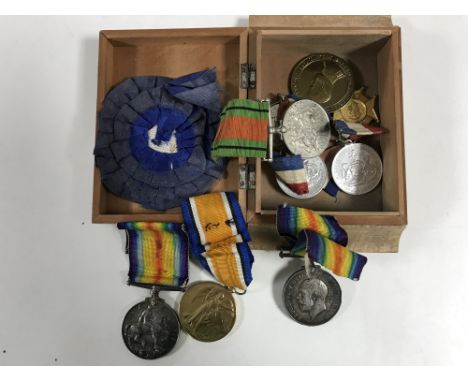 A box containing a collection of First and Second World War medals (qty)   CONDITION REPORT:  This includes a Victory Medal a