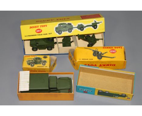 Four Dinky vehicles - 697 25-Pounder field gun set, 692 5.5 medium gun set, 1118 'International' 6x6 army truck and 670 armou