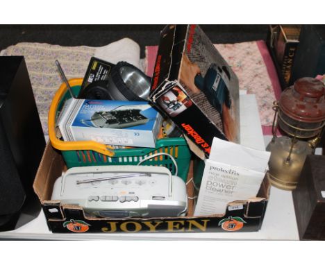 A box containing Black and Decker drill, steam cleaner, torches, battery charger, radio, tools, etc 