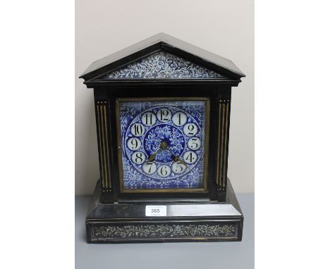 A Victorian ebonised cased mantel clock with blue porcelain dial