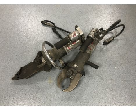 Two Amkus hydraulic cutting tools