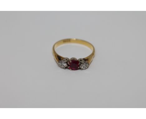 An 18ct gold ruby and two stone diamond ring, size O/P, 3.3g.