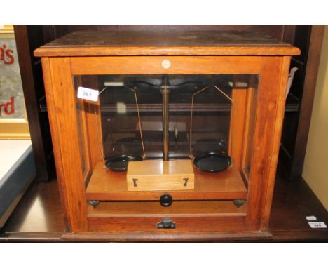 A mid twentieth century Brady and Martin Ltd chemist's scales in box with weights.
