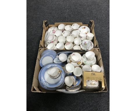 Two boxes containing assorted tea china and dinnerware, together with a boxed Ringtons golden jubilee commemorative tea caddy