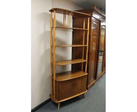 A mid twentieth century Ercol light elm tiered room divider, 'Giraffe', height 191cm  CONDITION REPORT: Some watermarks and o