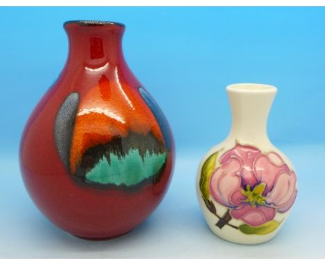 A small Moorcroft vase and a Poole pottery vase, 9cm and 13cm