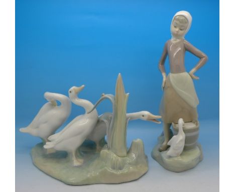 Two Lladro figures, boxed, 23.5cm