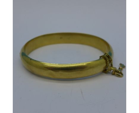 A Russian 56 gold bangle, (14ct), a/f, with key and chain, 12.7g