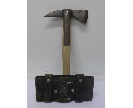 An axe, military issue marked with broad arrow, also marked Gilpin, 1967, 9104485