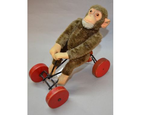 Steiff Original monkey on cart.