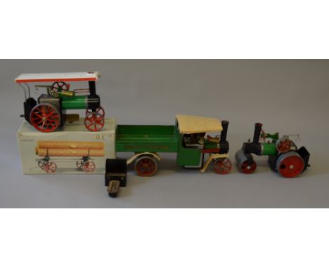 Live steam. Mamod steam wagon, steam roller & traction engine. Together with lumber wagon. Overall F/G Some repainting. (4)