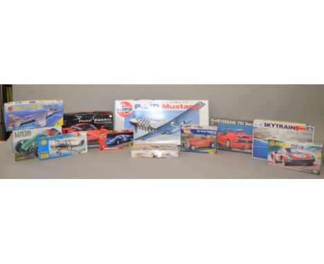 20 x car & air craft model kits, various scales. Airfix, Revell, etc. All appear unstarted, unchecked.
