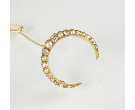 A late 19th century graduated pearl and diamond crescent brooch, designed as eleven graduated split pearls interspersed with 