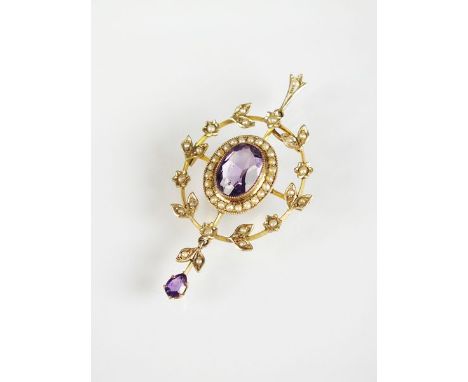An early 20th century amethyst and split seed pearl pendant, designed as a central oval mixed cut amethyst milligrain set in 
