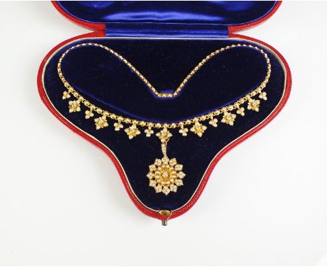 A late 19th century diamond and pearl necklace with removable pendant/brooch, the necklace designed as graduated split seed p