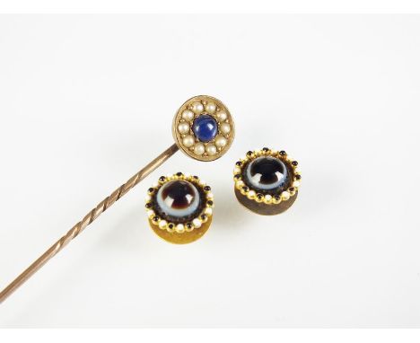 Two 19th century banded agate studs, with blue and white enamel border, together with a lapis lazuli and seed pearl stick pin