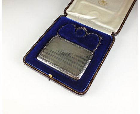 A cased silver purse, Goldsmiths & Silversmiths Co Ltd, London 1916, of rectangular form with Greek Key decorative border and