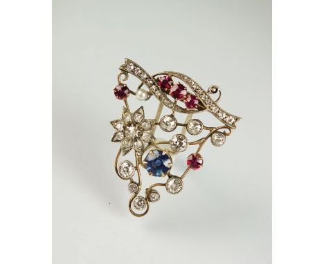 A diamond, ruby, sapphire and pearl brooch/pin, designed as an openwork yellow metal frame mounted with graduated collet set 