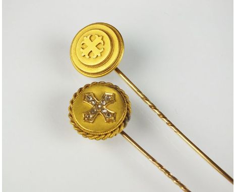 A diamond set stick pin, the old rose cut diamonds forming stylised Maltese cross, together with a further yellow metal stick