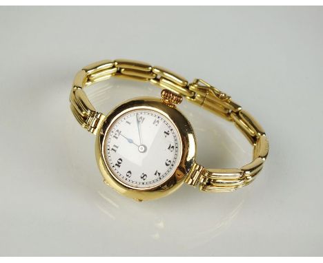 A Lady's 18ct gold Moeris Swiss made wristwatch, import mark for London 1919, the white enamel dial with black Arabic numeral