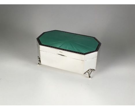 An Art Deco silver and enamel trinket box, Henry Clifford Davis, Birmingham 1929, of canted rectangular form with green guill