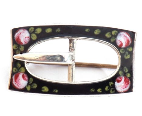 Silver and enamel "buckle brooch" of rectangular pierced shape on black ground enamel detail with each corner highlighted wit