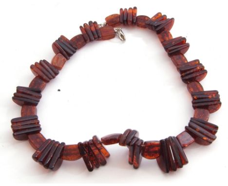 Modern cognac amber bead choker style necklace, a design featuring large ribbed beads interspersed with polished oblong beads