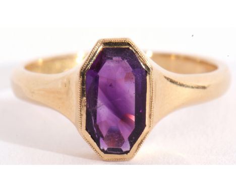 Mid-20th century 18ct gold and amethyst ring, the oval faceted amethyst in a rub-over setting, framed with millegrain edging,