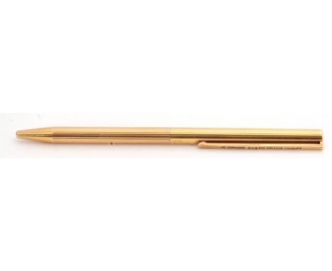 Vintage S T Dupont Paris gold plated pen, a revolving mechanism with textured engine turned link engraved detail, the clip en