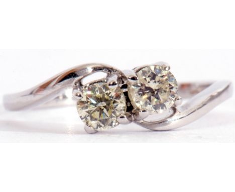 Precious metal diamond cross-over ring featuring two round brilliant cut diamonds, 0.15ct each approx, stamped 750, size L/M
