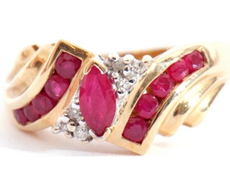 Modern 10K stamped ruby and diamond ring centring a lozenge shaped ruby highlighted with six small diamonds and having channe