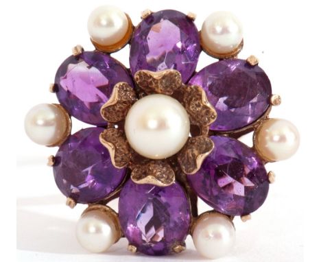 Large amethyst and pearl dress ring, a flowerhead design centring a cultured pearl raised by six oval faceted amethysts, high