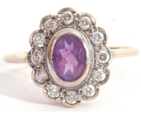 9ct gold amethyst and diamond cluster ring a design featuring an oval cut amethyst raised in cut down setting in a small diam