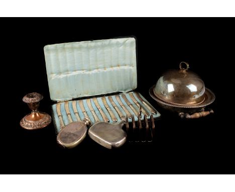 A collection of silver plated items, including a set of twelve silver handled butter knives in fitted case, a plated chamber 