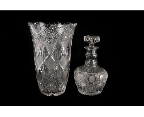 A vintage cut glass decanter, together with a large and heavy cut glass vase (2)