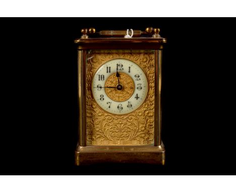 A early 20 century Carriage Clock, time only single train, cream dial with Arabic numerals and decorative front panel, bevel 