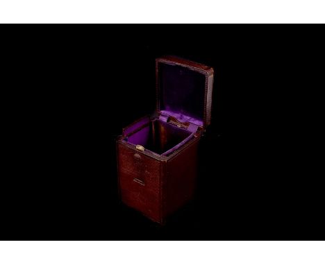 A leather carriage clock case, the tooled leather surround with hinged lid and slide out front, velvet interior, approx 16cm 