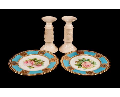 A pair of Minton style cabinet plates,  with central rose design, gilt edging with scroll design and insect roundels within a