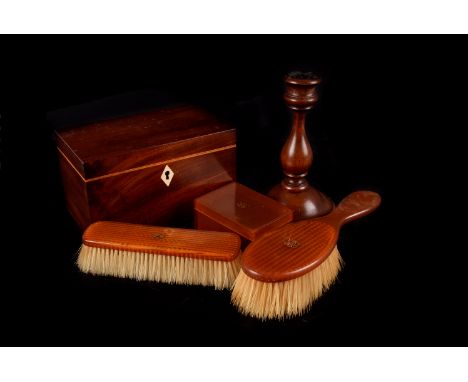 A Mahogany veneer Tea caddy, together with a pair of turned mahogany candlesticks with weighted bases and a quantity of clear