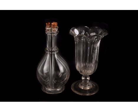 A four chamber cordial decanter, of heavy blown clear glass design together with a wide trumpet shaped celery vase.