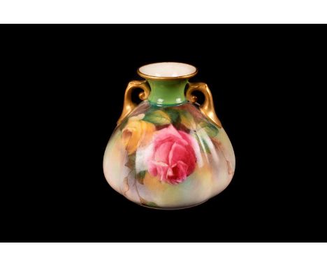 A Royal Worcester Rose vase, the twin handled vase having rose design, with gilt decoration to the handles and rims, approx. 