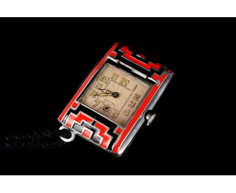 An Art Deco period lady's purse watch, the rectangular cushion case having red and black enamel designs, damaged, concealing 
