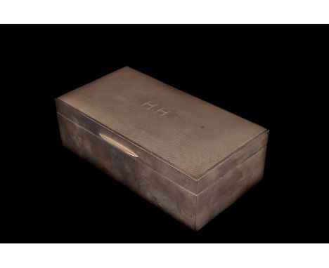 A modern silver cigarette box,  the hinged lid engraved with initials H.H. on an engine turned top, Birmingham 1967